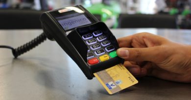 person paying by card - millennials living on a budget