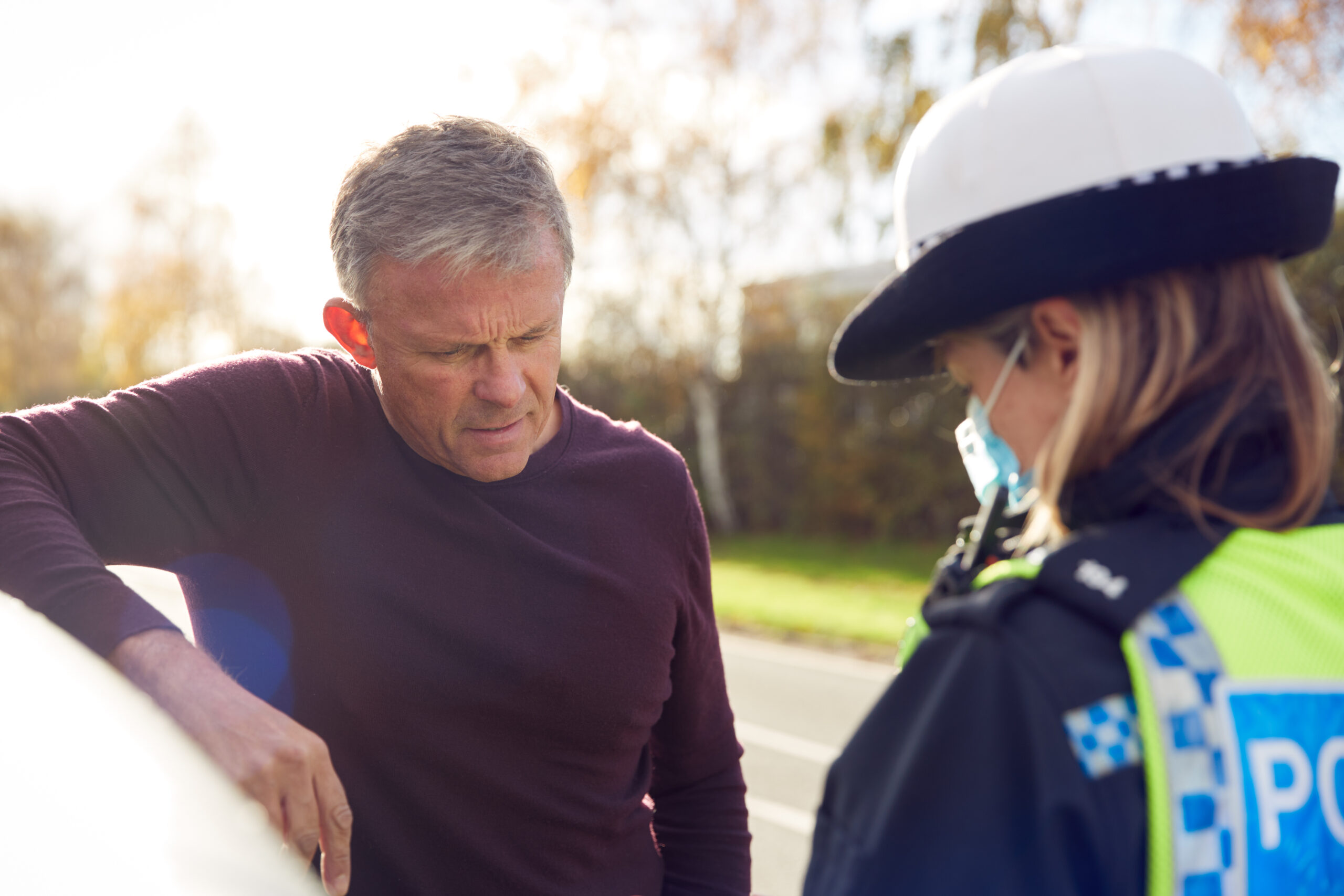 Man being handed driving offence